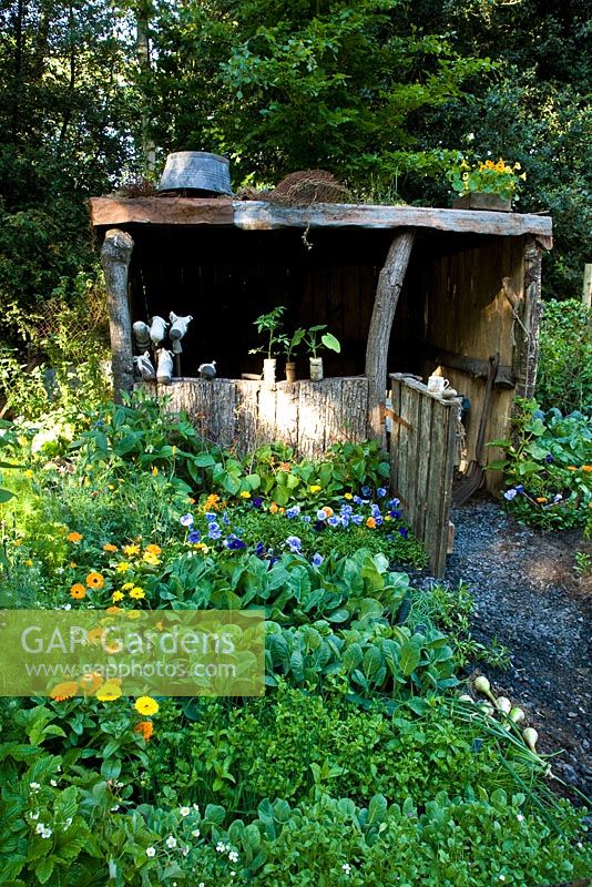Rustic wooden shelter in vegetable garden - 'A Child's Garden in Wales', Silver Medal Winner, RHS Chelsea Flower Show 2011 
