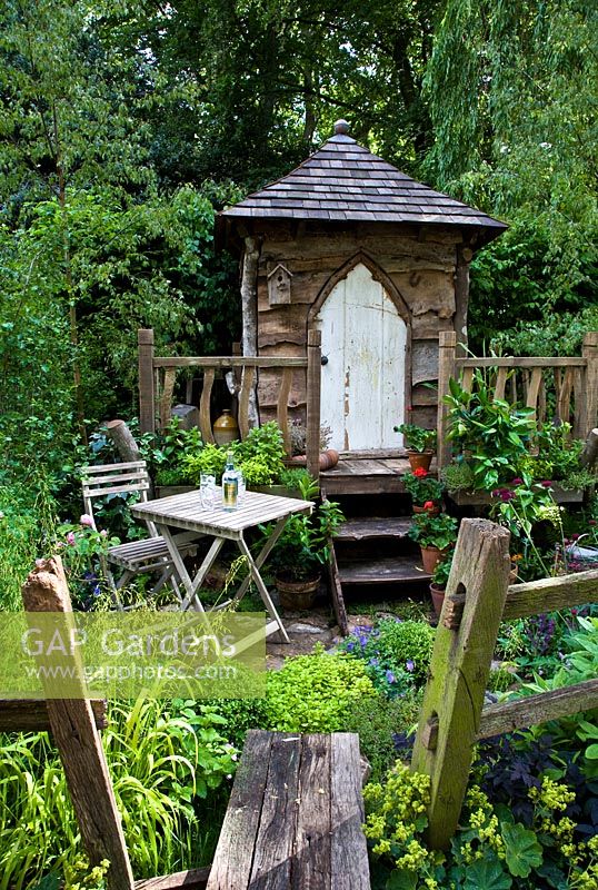 Tree house partly made with reclaimed wood from Cinchona calisaya, surrounded by informal planting in the 'Fever Tree's Tree House Garden' - Silver Medal Winner, RHS Chelsea Flower Show 2011 
