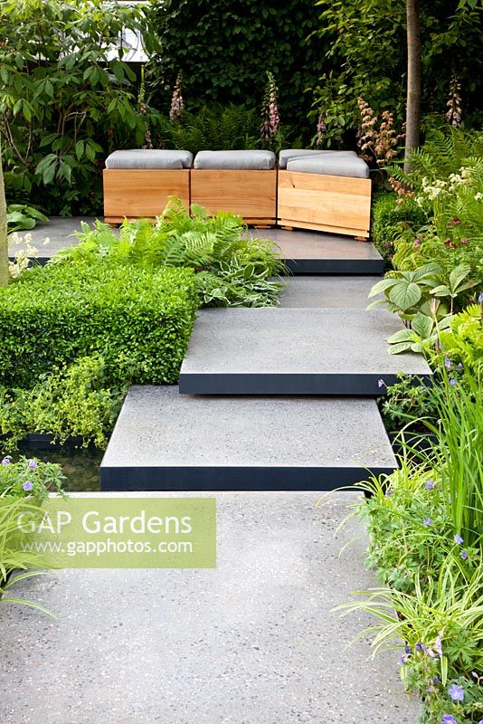 Polished concrete pads form stepping-stones across stream in 'The Lands End Across the Pond Garden' - Gold Medal Winner, RHS Chelsea Flower Show 2011