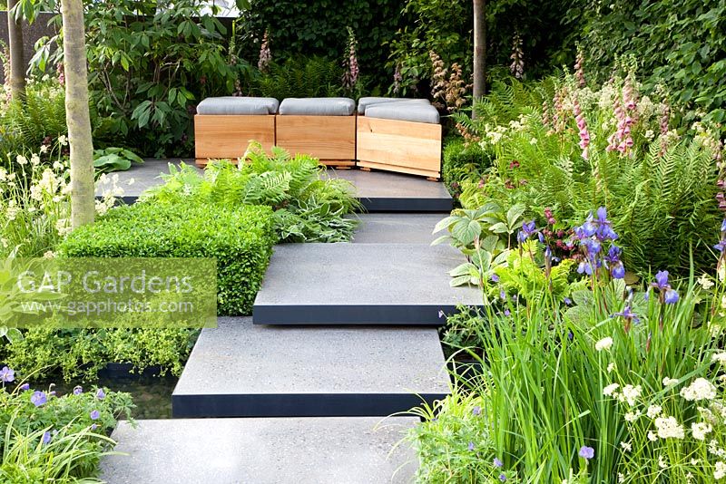 Polished concrete pads form stepping-stones across stream in 'The Lands End Across the Pond Garden' - Gold Medal Winner, RHS Chelsea Flower Show 2011
