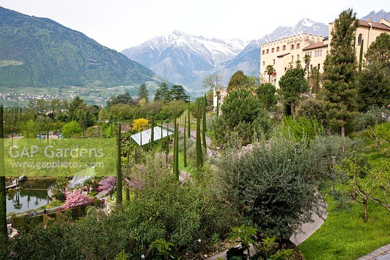 The Botanical gardens of Trauttmansdorff Castle in Merano, Italy with the castle in the background.