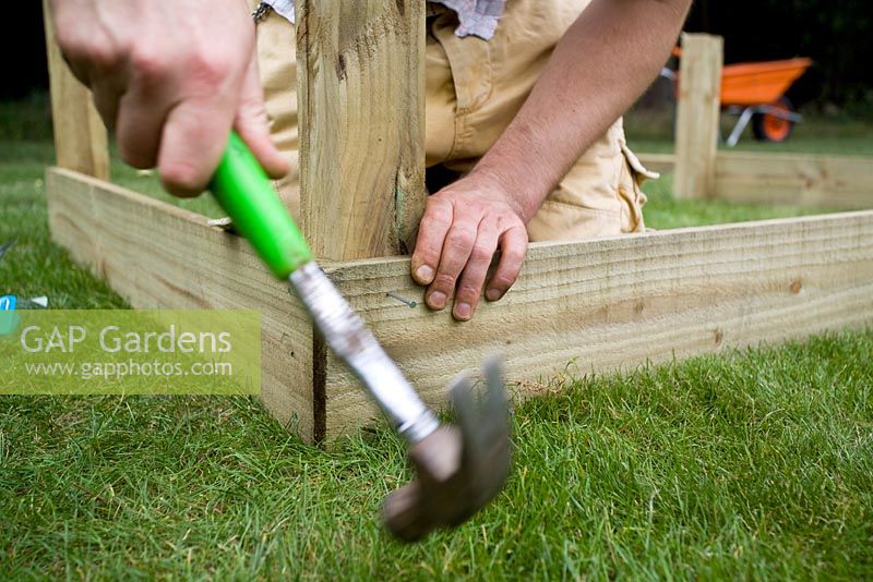 step by step, making a raised bed - attaching sides to corner posts