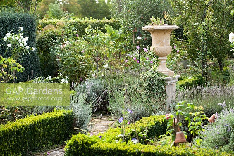View across the garden with decorative urn as focal point, Garden Hackl, Mistelbach Austria