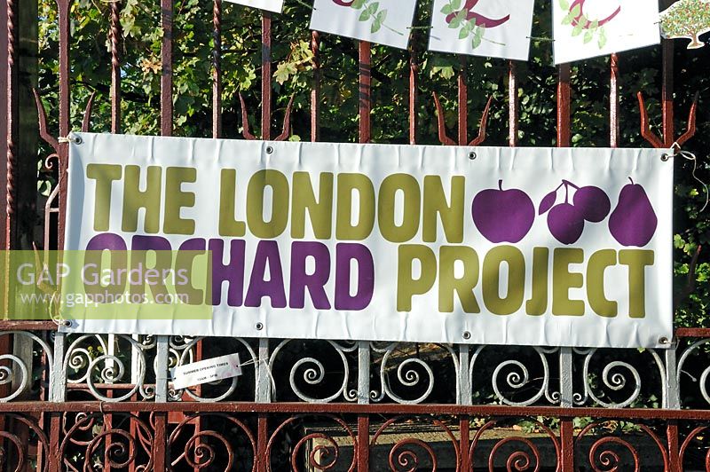 London Orchard Project sign displayed on the entrance gates to Camley Street Natural Park for apple day, King's Cross, London Borough of Camden, London, UK