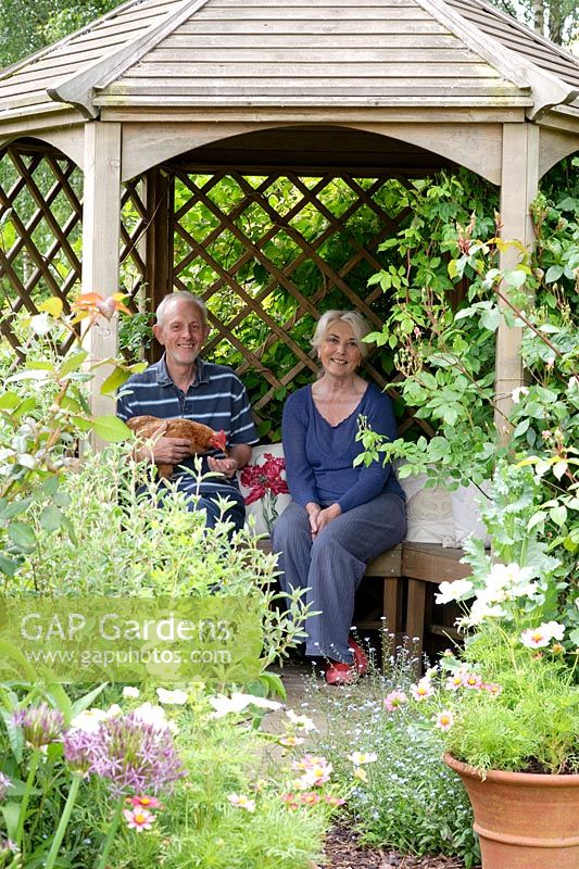 Portrait of Sue and Doug Copeland in summerhouse - Wickets, Essex NGS