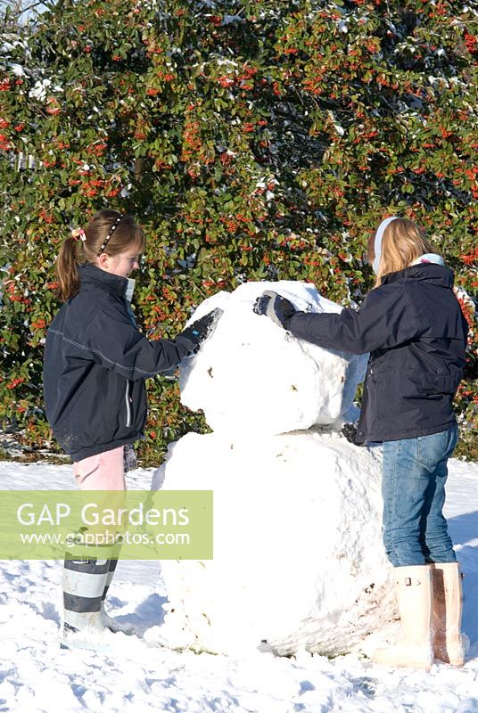 Children making a giant snow man. Gowan Cottage