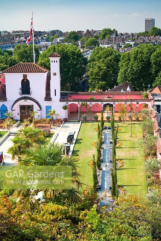 View of The Spanish Garden at The Roof Gardens, Kensington with city beyond