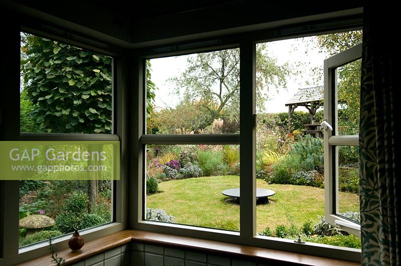 View of garden through window - Brook Hall Cottage