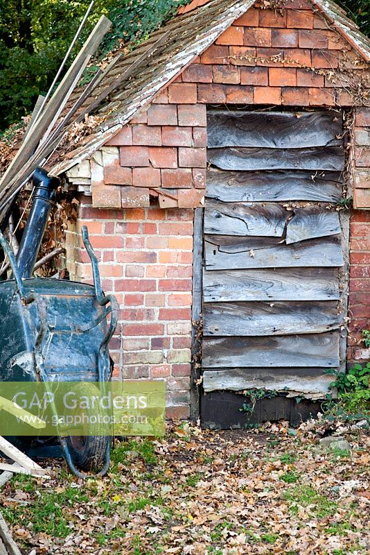 Tiled storage outhouse with wheelbarrow - Vann, Surrey