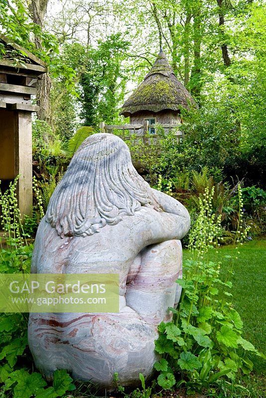 The Stumpery with a statue 'Goddess of the Woods', and the tree house - Highgrove Garden, May 2008.