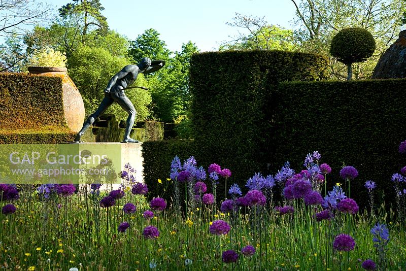 Spring wild flowers and bronze Borghese Gladiator. Highgrove Garden, May 2010. 