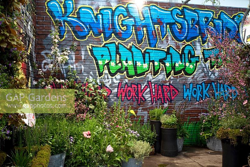 Graffiti on the wall of garden at Chelsea Flower Show 2012