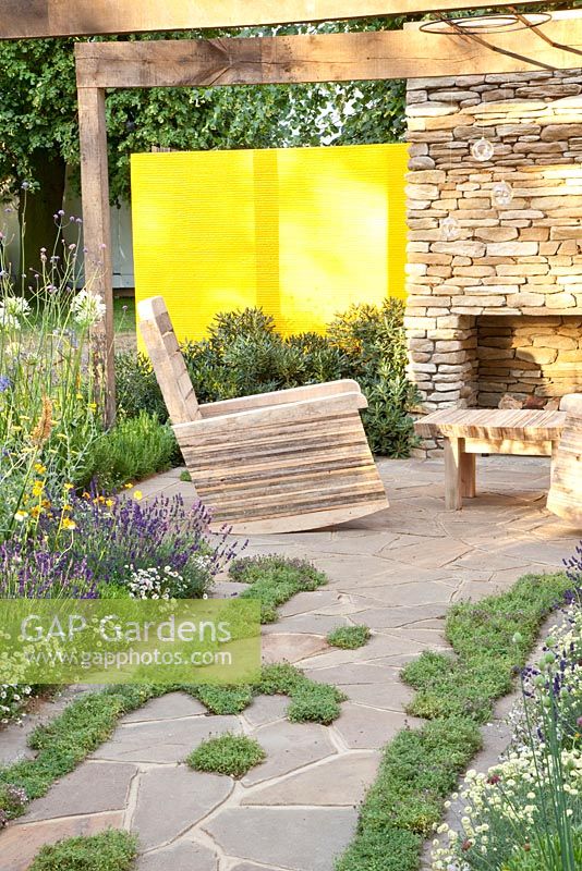 Mediterranean terrace with furniture made from recycled pallets 

