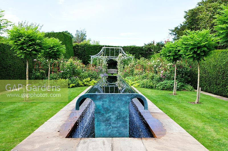 Water feature  by William Pye in the Rose Garden. Clinton Lodge, Fletching, East Sussex, UK. July