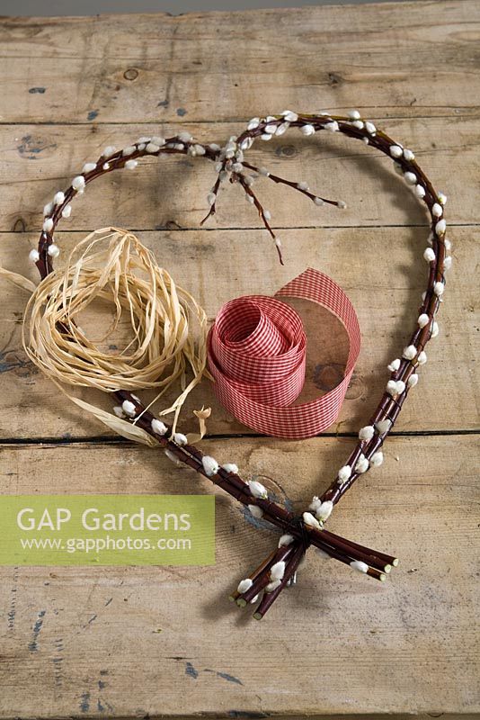 Step-by-step - Attaching ribbon and thread - making heart shaped decoration using Salix caprea, pussy willow 