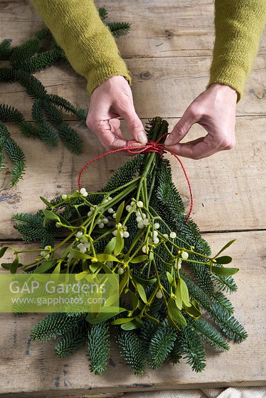 Step-by-step - Making natural Christmas decorations using branches from pine tree and mistletoe - trimming and tying together