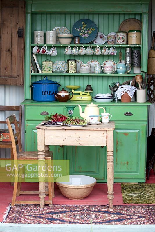 An old tin field shelter has been converted into a preserving kitchen - Preserving the Community - Silver medal winner - RHS Hampton Court Flower Show 2012.