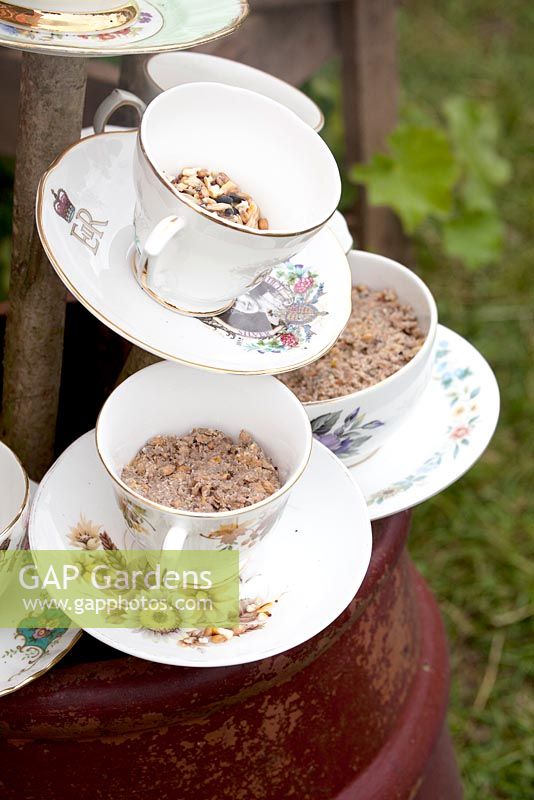 Teacups on sticks filled with birdseeds. Preserving the Community - Silver medal winner - RHS Hampton Court Flower Show 2012.