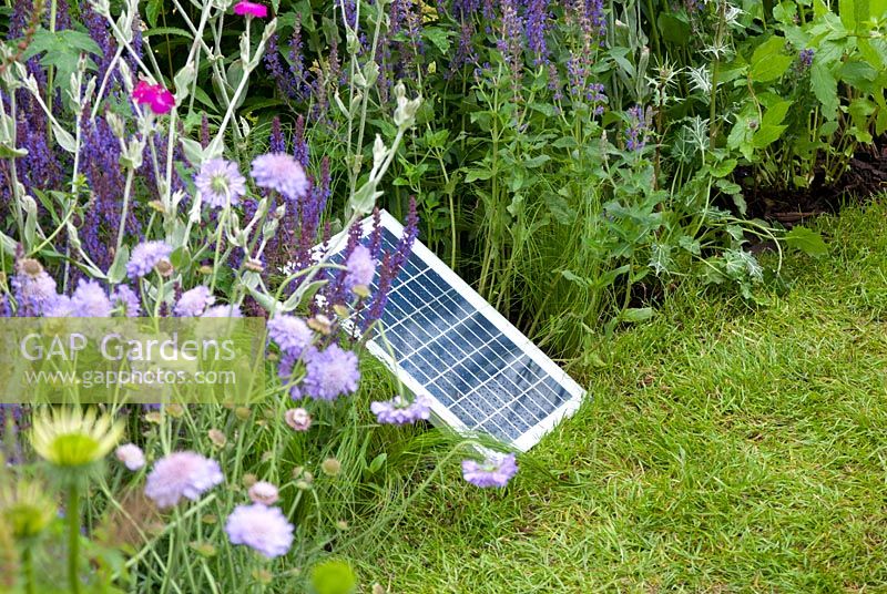 Solar panel in herbaceous bed in the 'Ring the Changes' garden, RHS Tatton Flower Show 2012