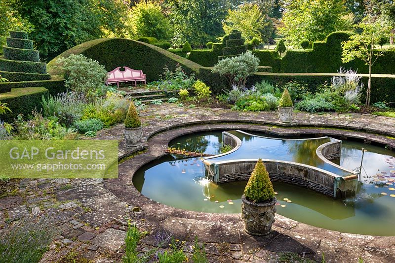 Lily Pool Garden. The pool designed in the shape of a lily, Highgrove, September 2012. This area of the garden is planted in a Mediterranean style. 