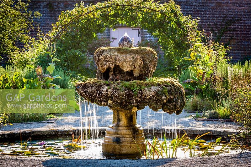The Walled Garden fountain covered in moss, Highgrove September, 2012.