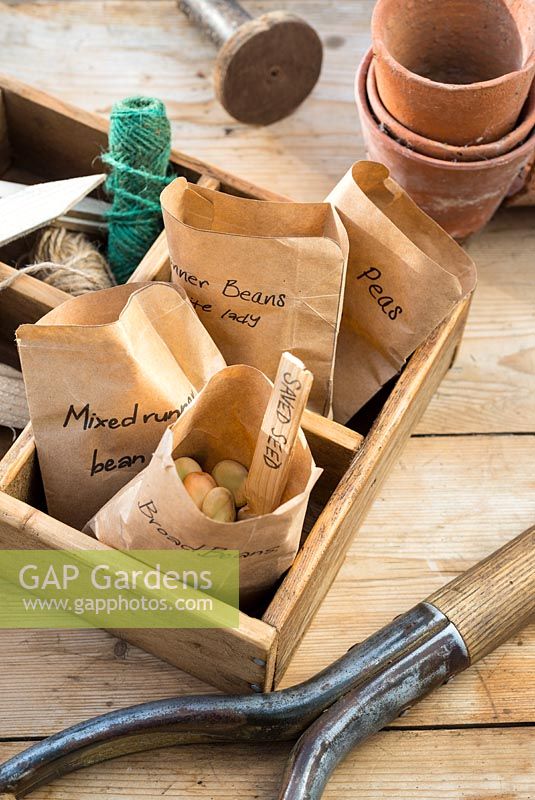 Spring time potting bench with packets of saved seeds