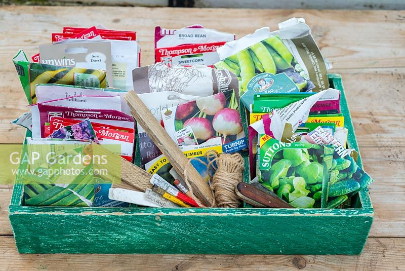 Spring time potting bench with seed packets stored in wooden box