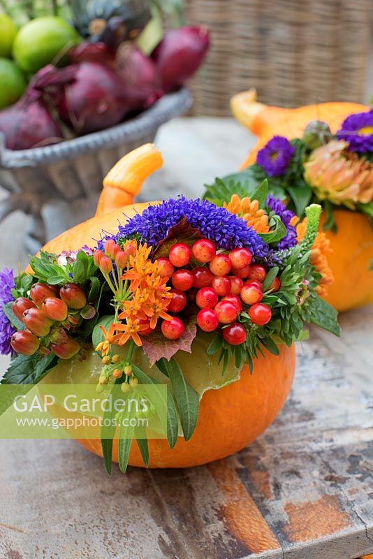 Pumpkin decorated with autumn flower display
