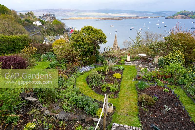 Coastal garden with panoramic views over the bay at Tobermory, Isle of Mull,
