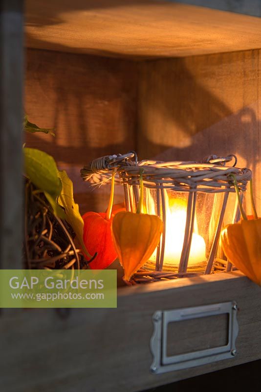 Candle holder with Physalis decoration