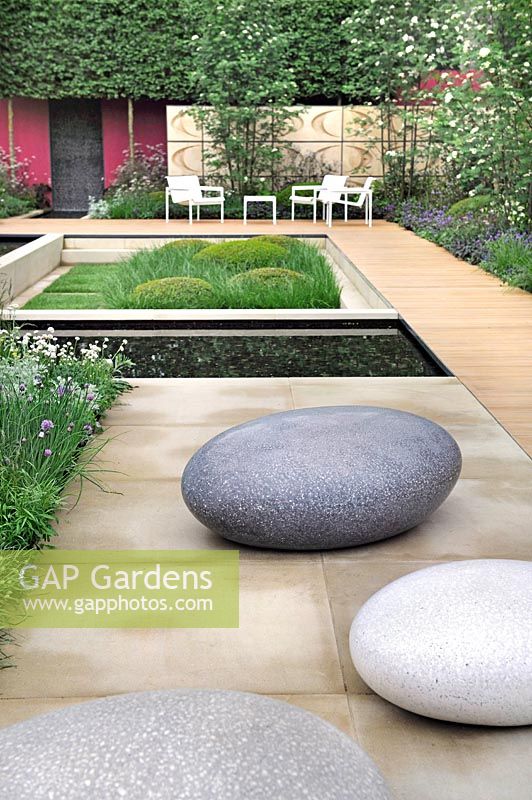 The Brewin Dolphin Garden - Large pebble seats, paving, pond, boardwalk and furniture 
