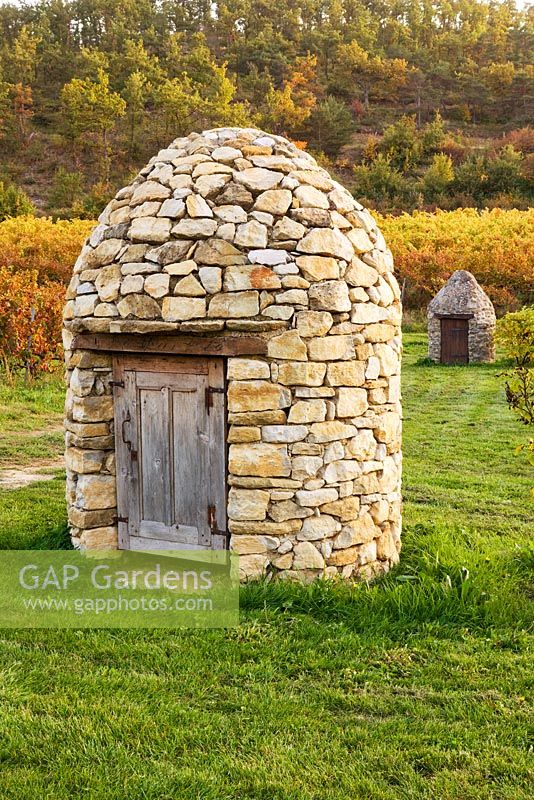 Vineyards and the stone well house. Provence, France, Domaine de la Verriere