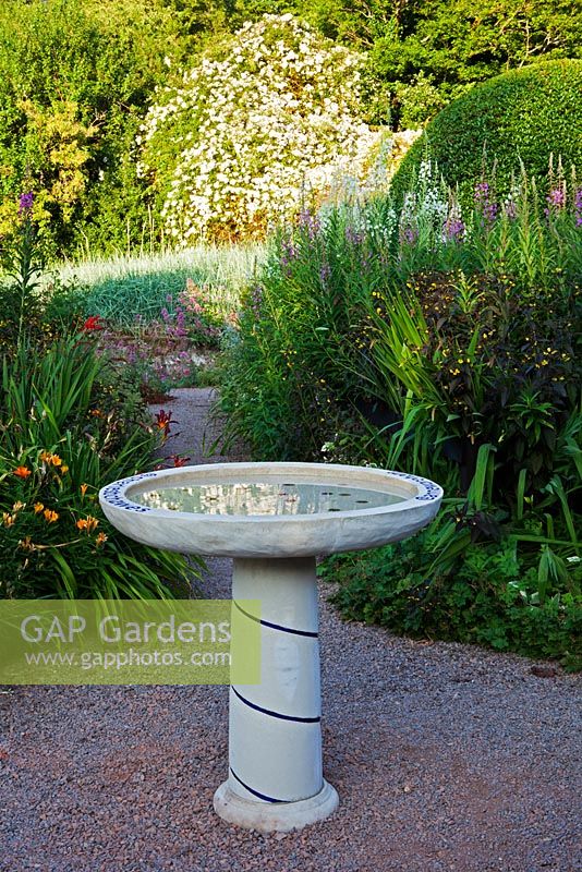 Bird Bath designed and decorated by Anne Wareham and made by Chilstone. Veddw House Garden, Devauden, Monmouthshire, Wales