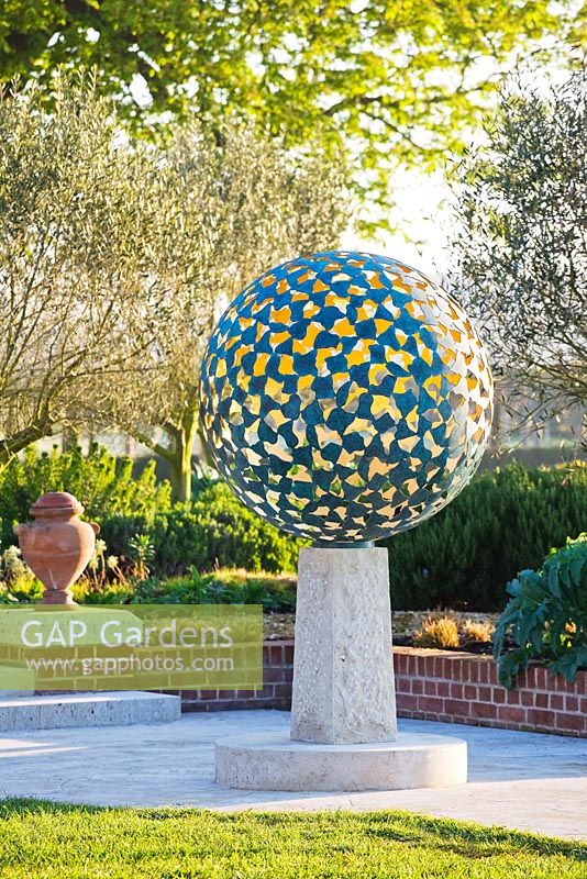 The Mantle - A verdigris bronze sphere consisting of dozens of individual bronze petals welded together 