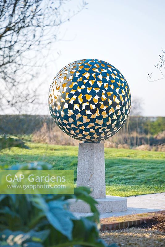 The Mantle - a verigris bronze sphere consisting of dozens of individual bronze petals welded together 