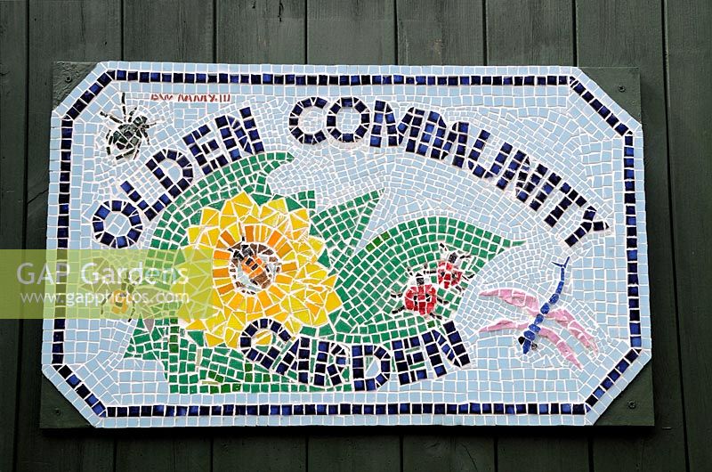 Mosaic plaque or sign on the door to the Olden Community Garden, Highbury, London Borough of Islington 