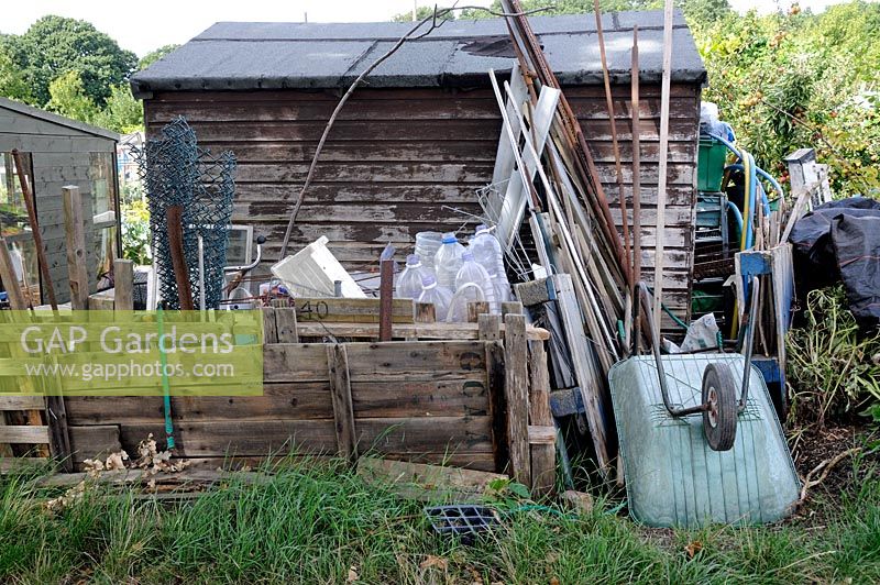 Recycled items stored behind an allotment shed, Golf Course Allotments, London Borough of Haringey.