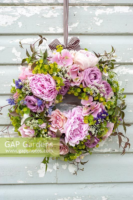 Summer wreath with roses, peonies, euphorbia, cow parsley and clematis