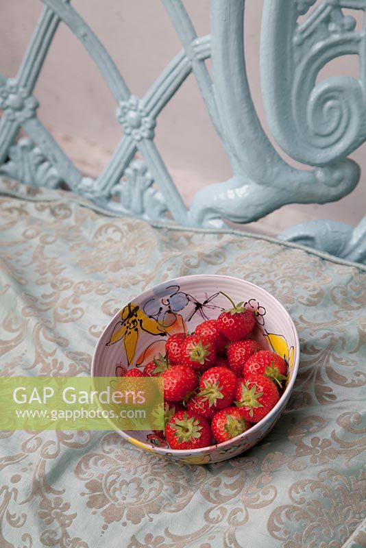 Fresh strawberries in bowl hand crafted by artist Tina Davies