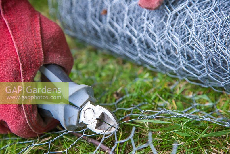 Fencing off a Rabbit hole - Cutting off length of chicken wire to cover rabbit hole