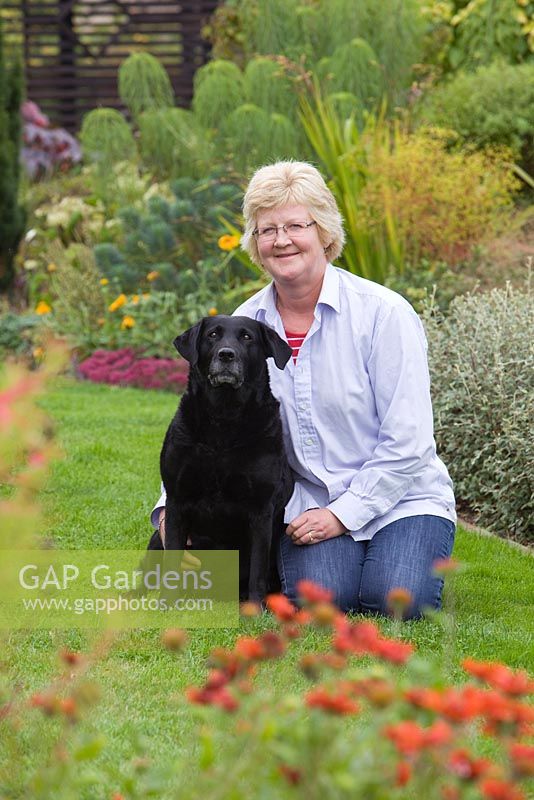 Garden owner Helen Boothman, with her dog Lucy. September, Autumn 2014.