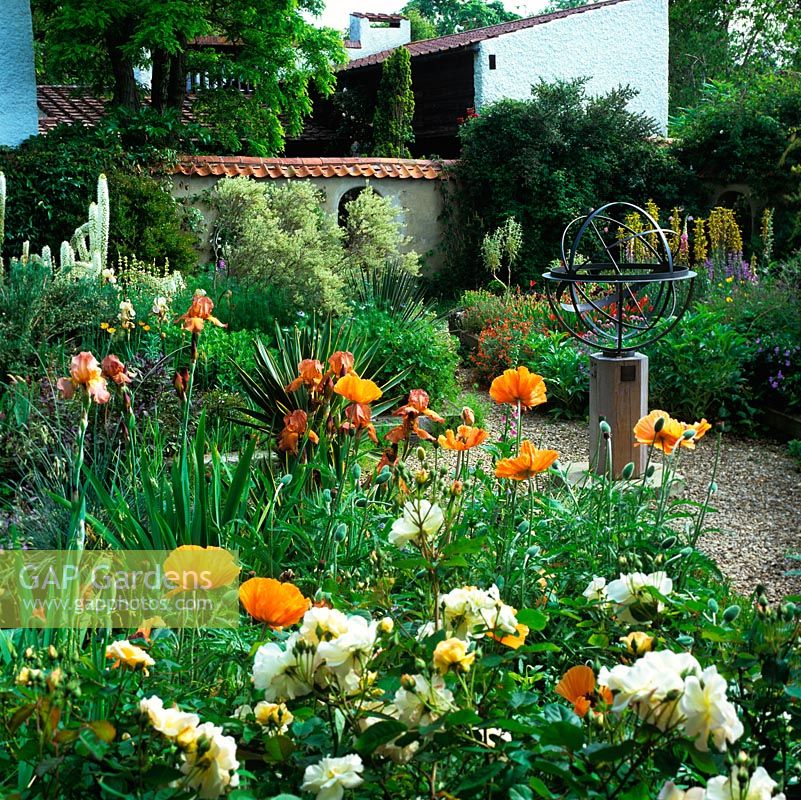 Walled, mediterranean garden with armillary sphere and beds of Papaver Turkish Delight, Rosa White Pet, foxtail lilies, iris, geum, tulip, cistus and asphodeline.