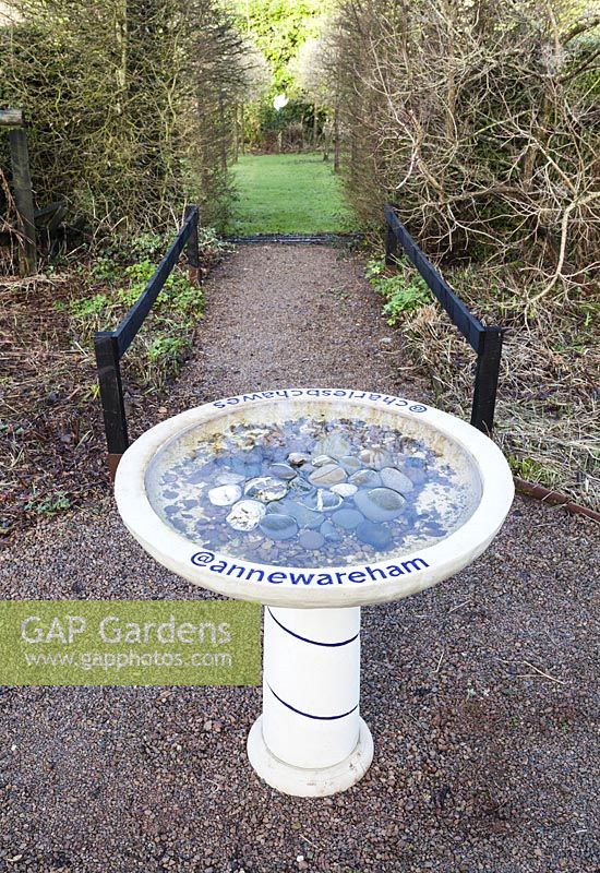 The Bird Bath in the Front Garden. Inscribed with Twitter names of owners of Veddw House Garden, Devauden, Monmouthshire, Wales. UK. 