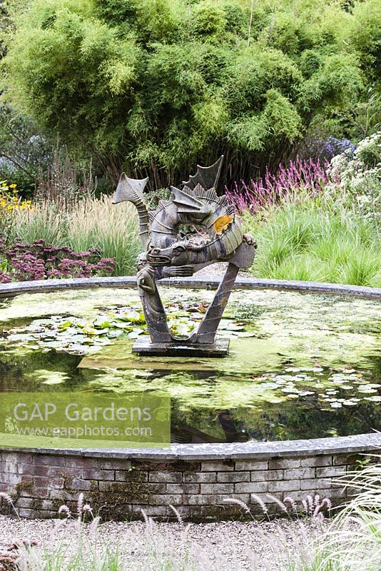The Pond with dragon sculpture - Knoll Gardens, Wimborne Minster, Dorset. Designed and owned by Neil Lucas. September