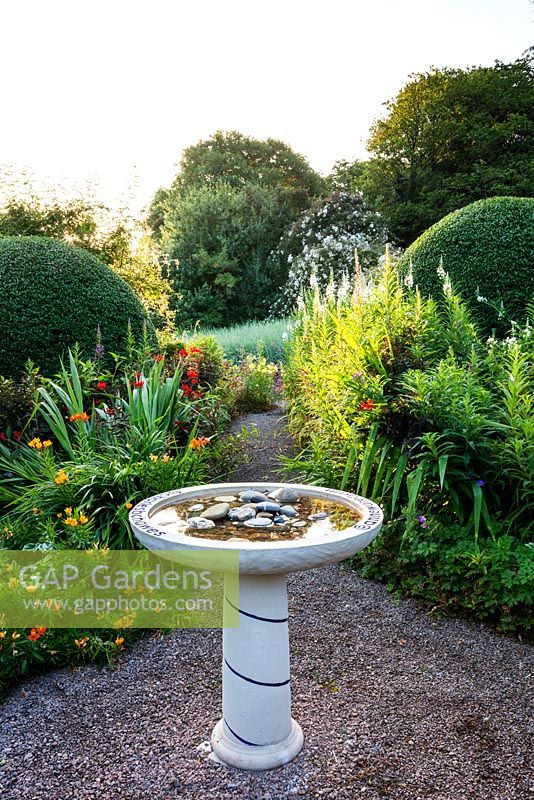 Birdbath in the Front Garden. Veddw House Garden, Devauden, Monmouthshire, Wales. July