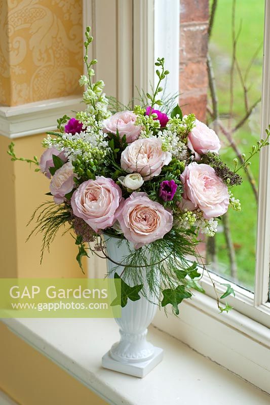 Pink roses in an arrangement. Rose 'Keira' a cut flower variety from David Austin Roses
