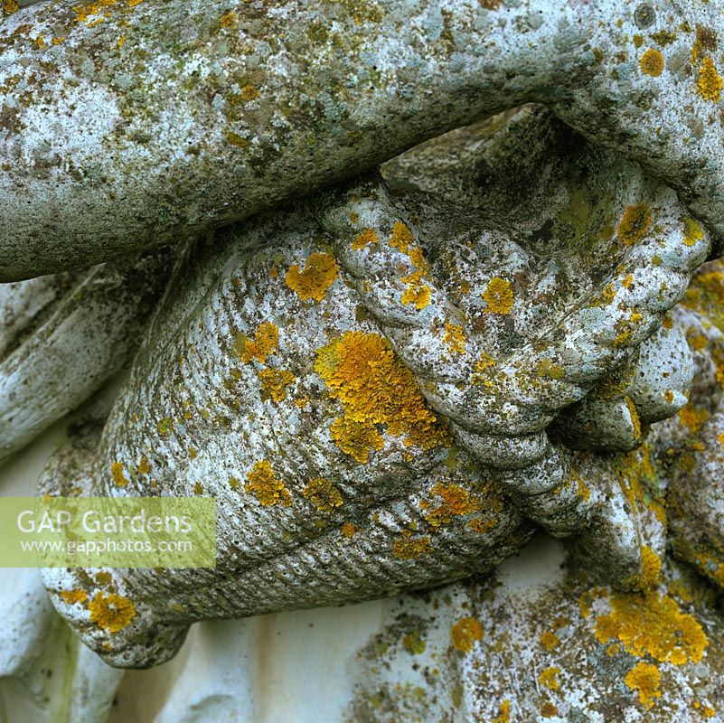 Lichen growth is well developed on this 50-year-old, reconstituted stone-and-marble statue.