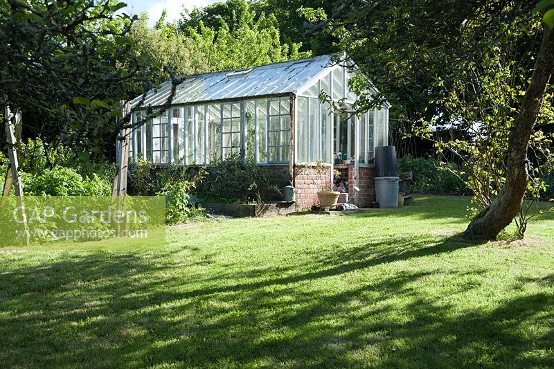 Greenhouse in the kitchen garden. Caervallack Farm, nr Helston, Cornwall, UK