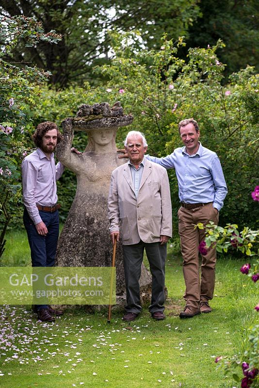 Three generations of David Austin Roses. Portrait of Mr David Austin OBE VMH, accompanied by his son, also David, managing director, and grandson, Richard, in charge of branded products for the family business.