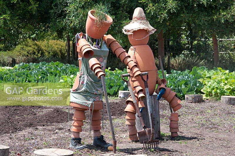 Scarecrows made from terracotta plant pots. Bablyonstoren  Cape Dutch farm vegetable garden. Nr Franschoek. South Africa